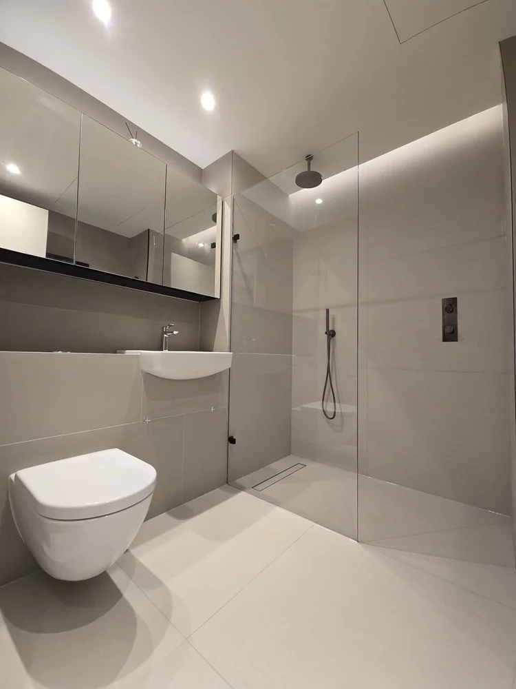 Bathroom renovation in Covent Garden with walk-in shower by RELM Interiors