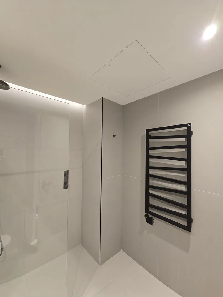 Walk-in shower and black towel radiator, Covent Garden bathroom by RELM Interiors