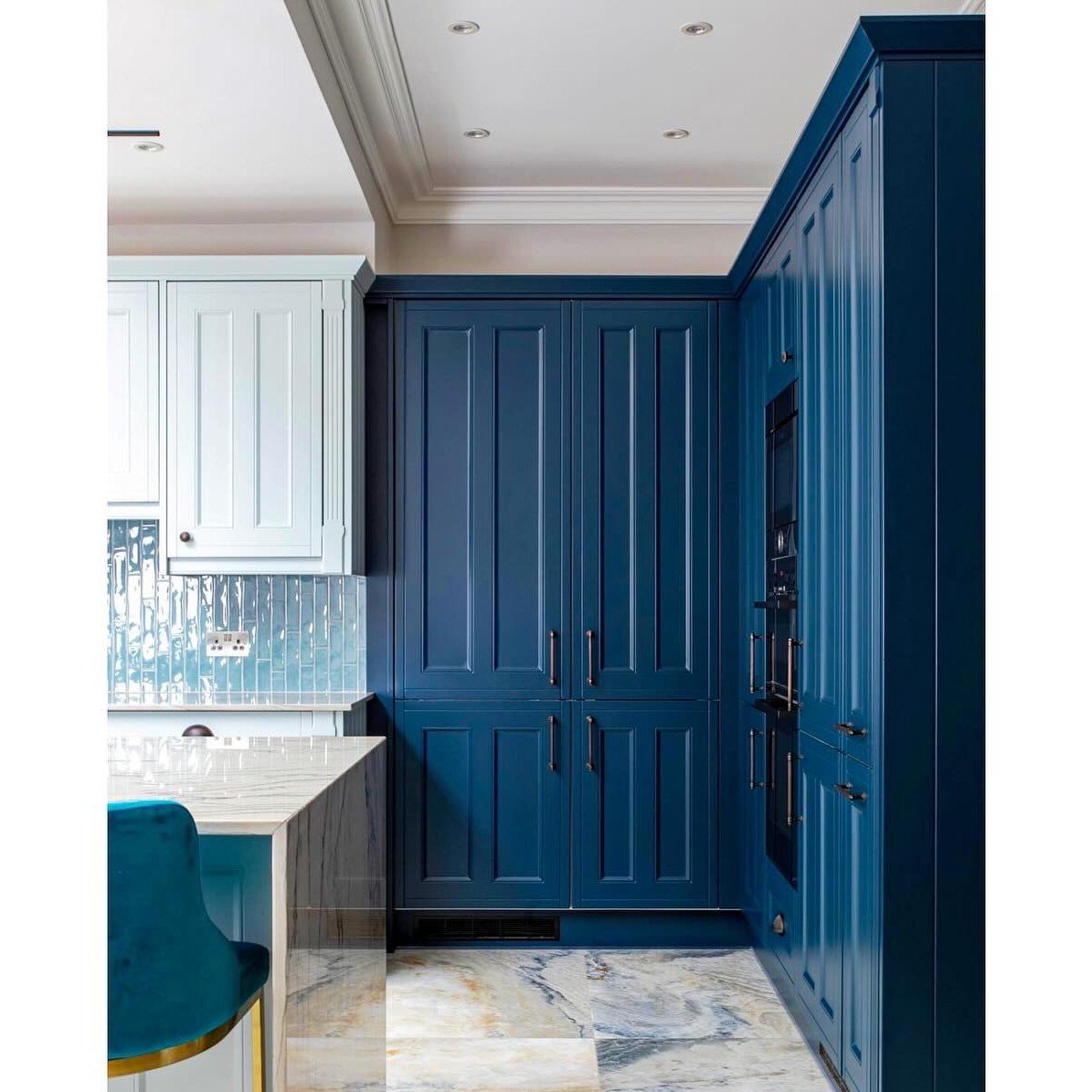 Bespoke painted kitchen cabinetry in deep blue by RELM Interiors