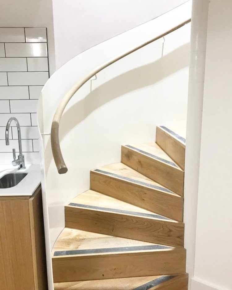 Curved staircase by RELM Interiors