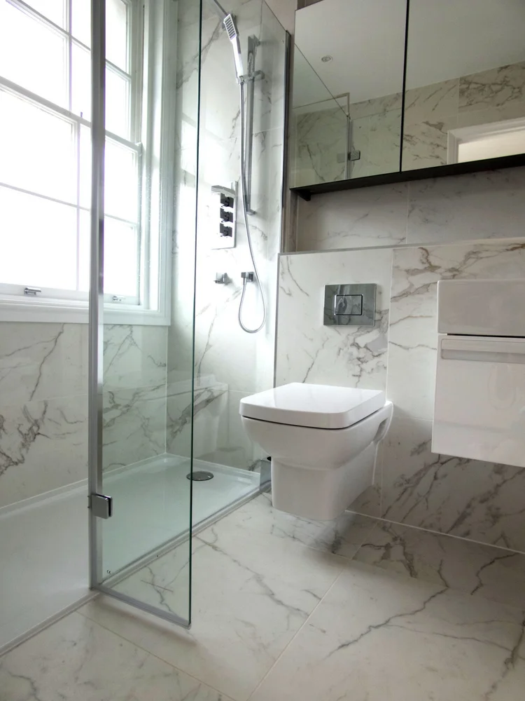 Shower room in a Mayfair flat by RELM Interiors