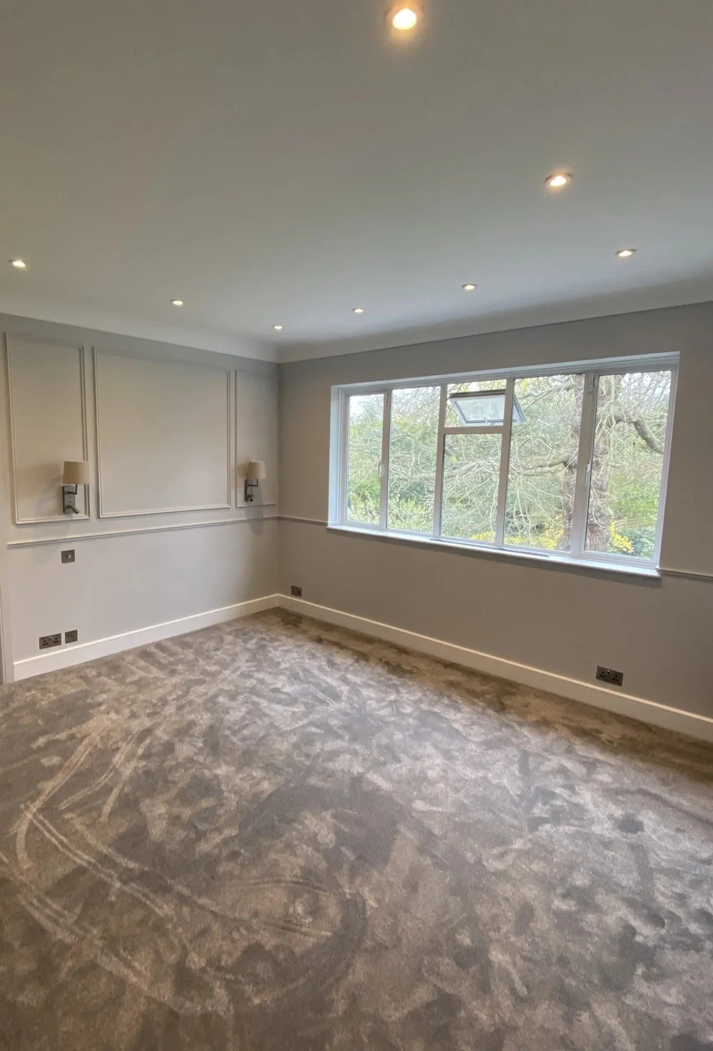 Panelled wall with shelving in Wimbledon