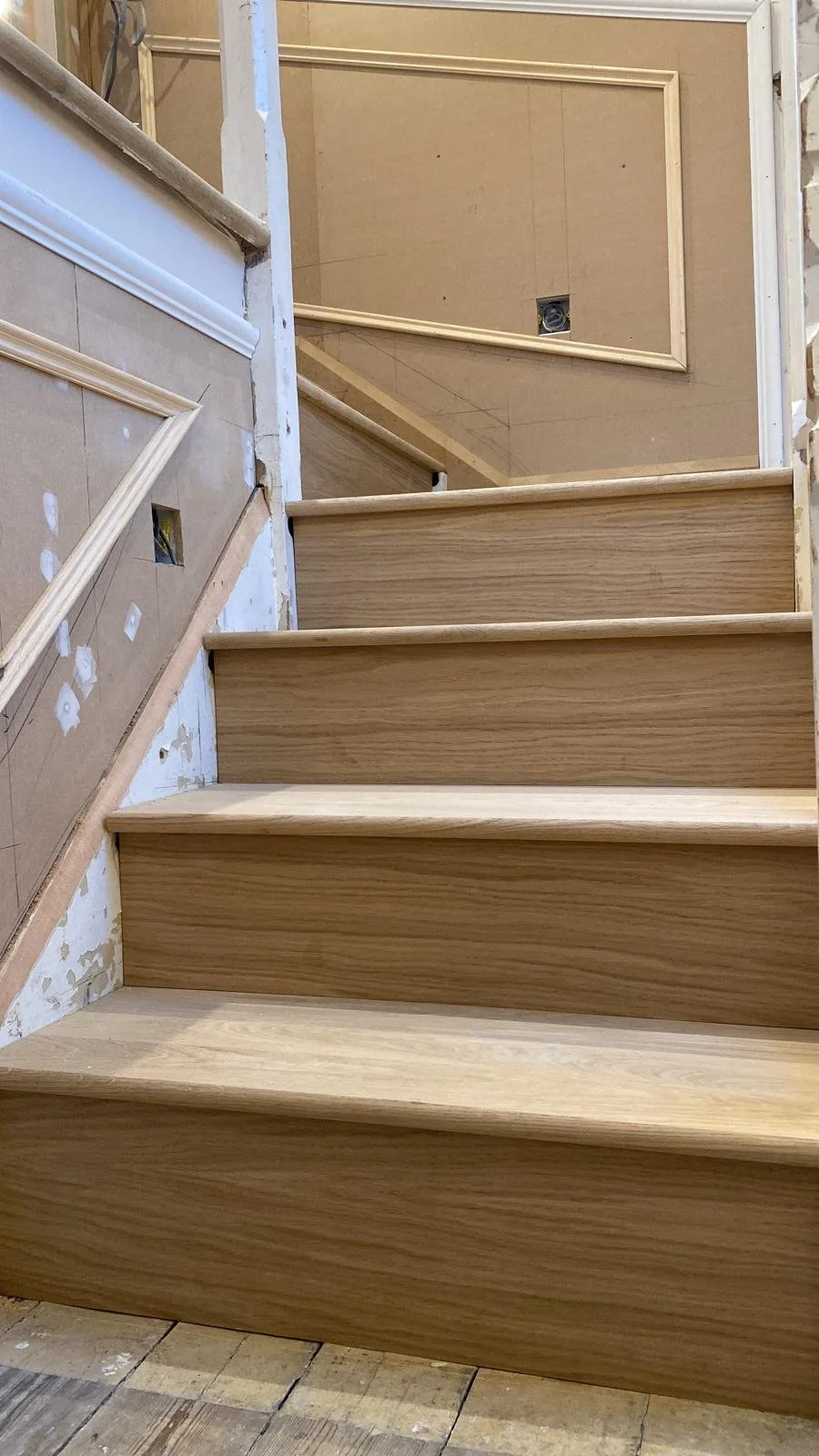 New oak stair treads and risers fitted in a Wimbledon house renovation