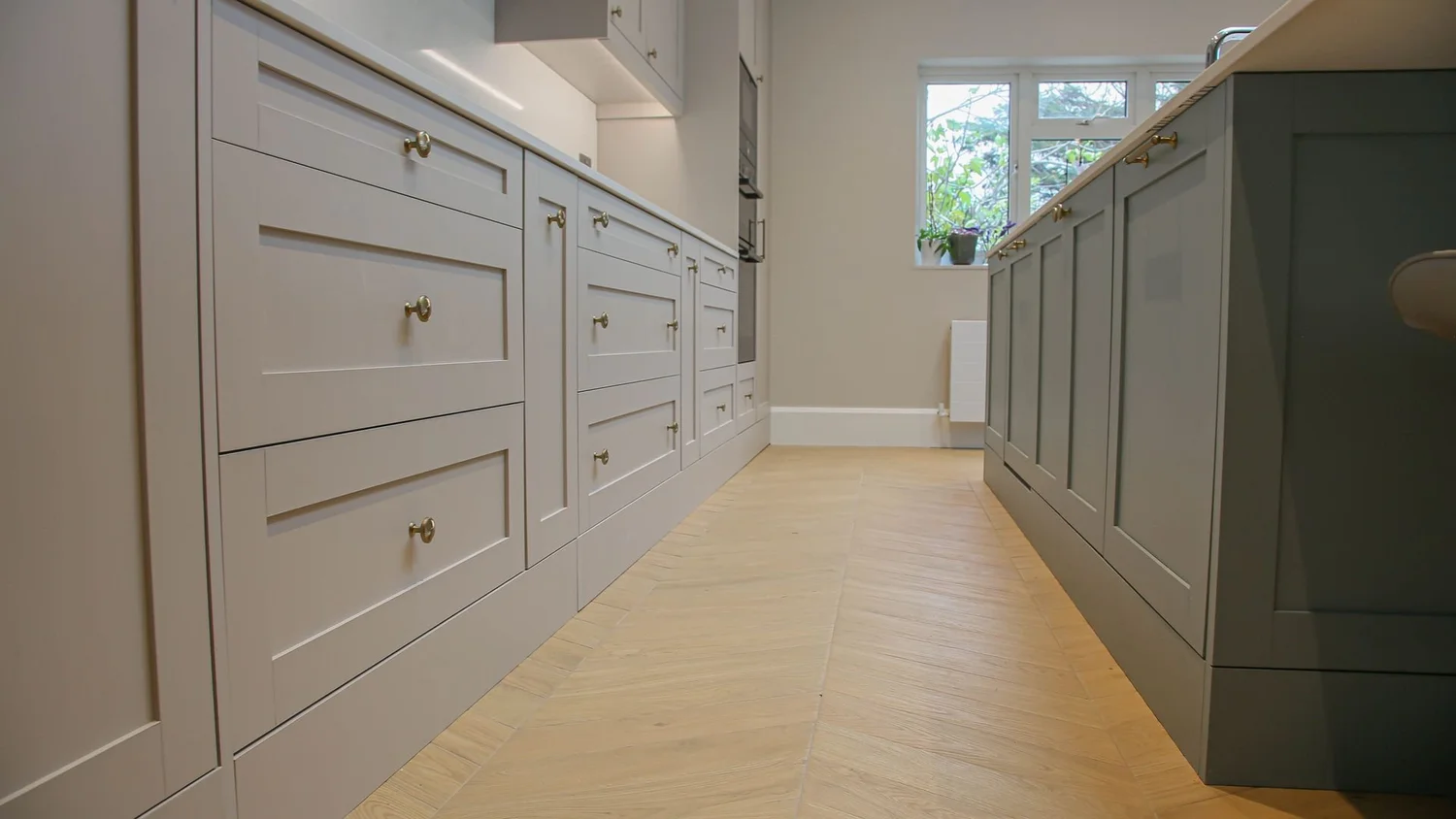 Painted bespoke kitchen units and island made and fitted by RELM Bespoke in Morden