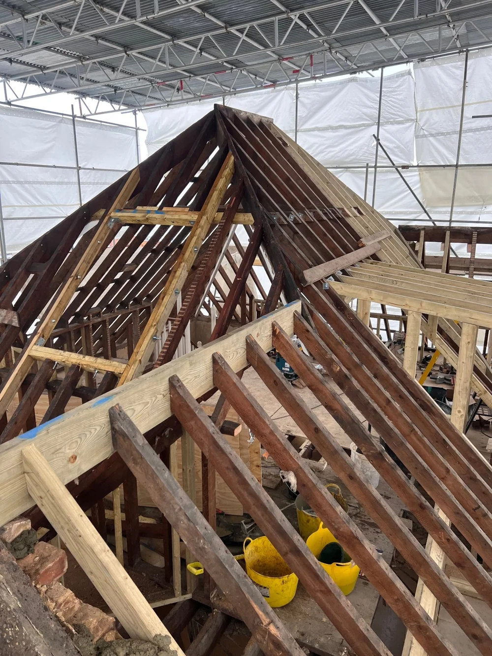 Roof structure opened up and strengthened with new timbers during a Wimbledon renovation by RELM Interiors
