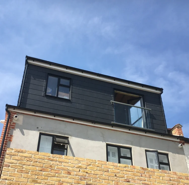 Dormer loft conversion with glass Juliet balcony in Wimbledon