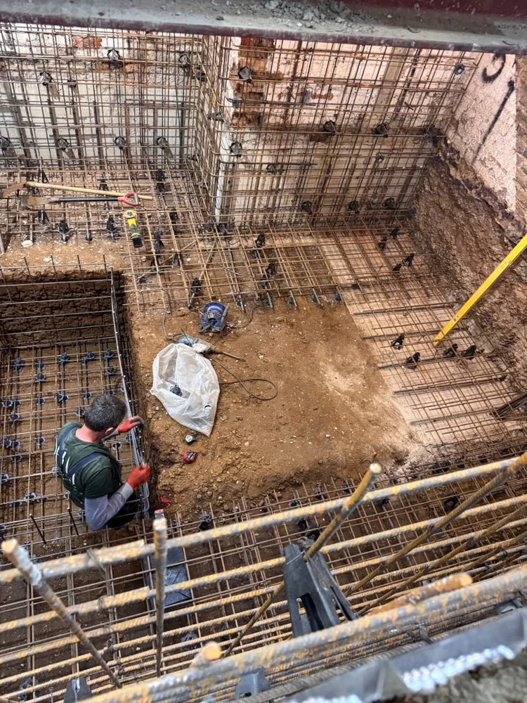 Basement excavation with reinforcement fixed to the walls, by RELM Interiors