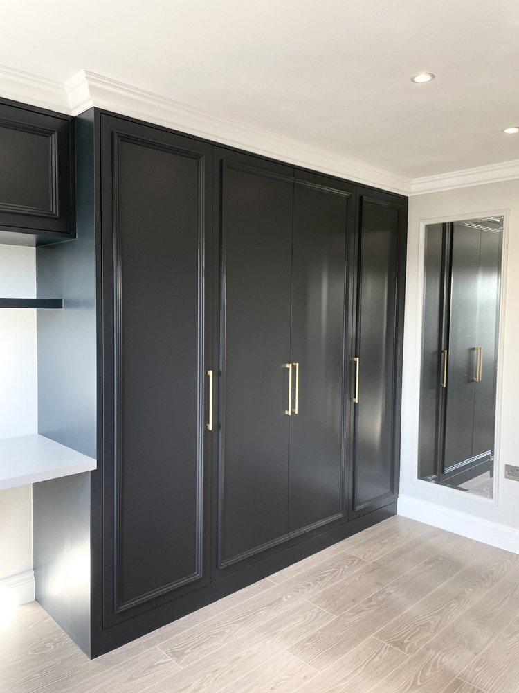 Wardrobe & work area by RELM Interiors