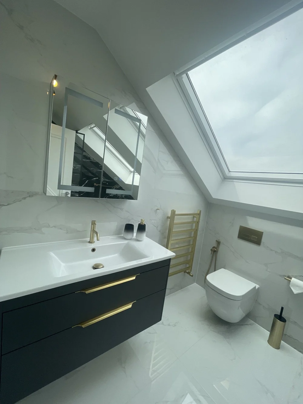 Loft en suite shower room in Wimbledon by RELM Interiors