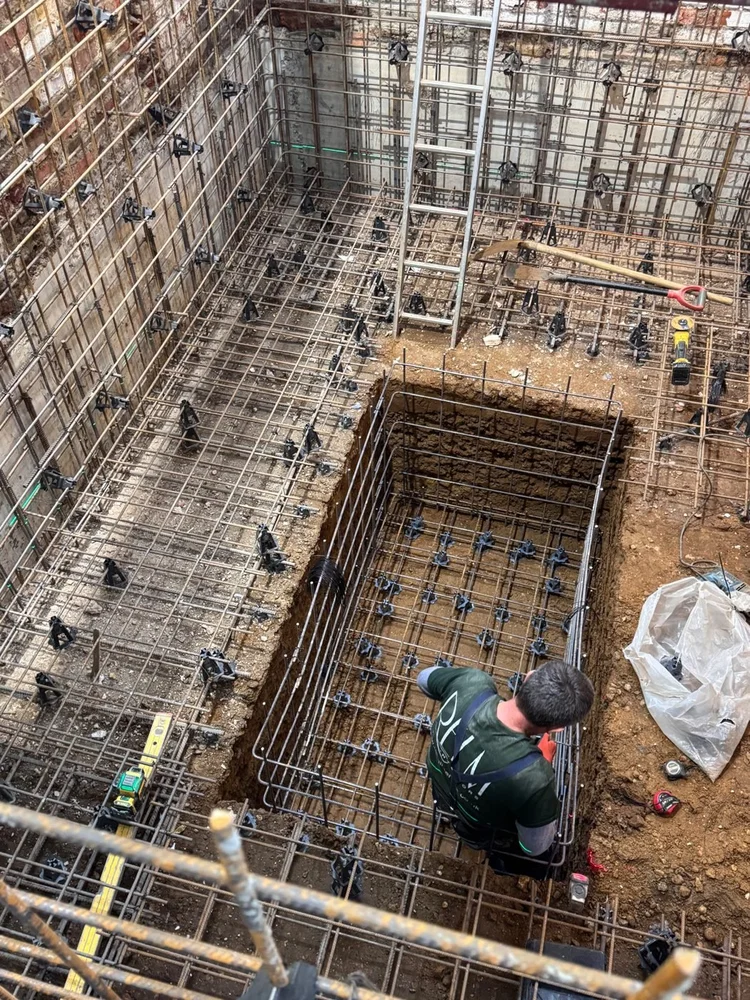 RELM Interiors team fixing reinforcement in a new basement, by RELM Interiors