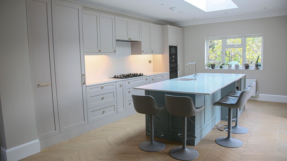 Open-plan kitchen in a rear extension in Wimbledon by RELM Interiors