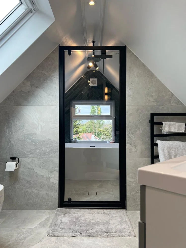 Loft conversion with en suite in Morden by RELM Interiors