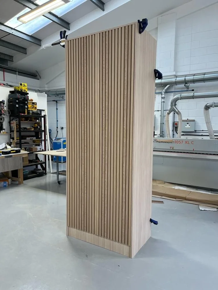 Oak-panelled wardrobe by RELM Interiors