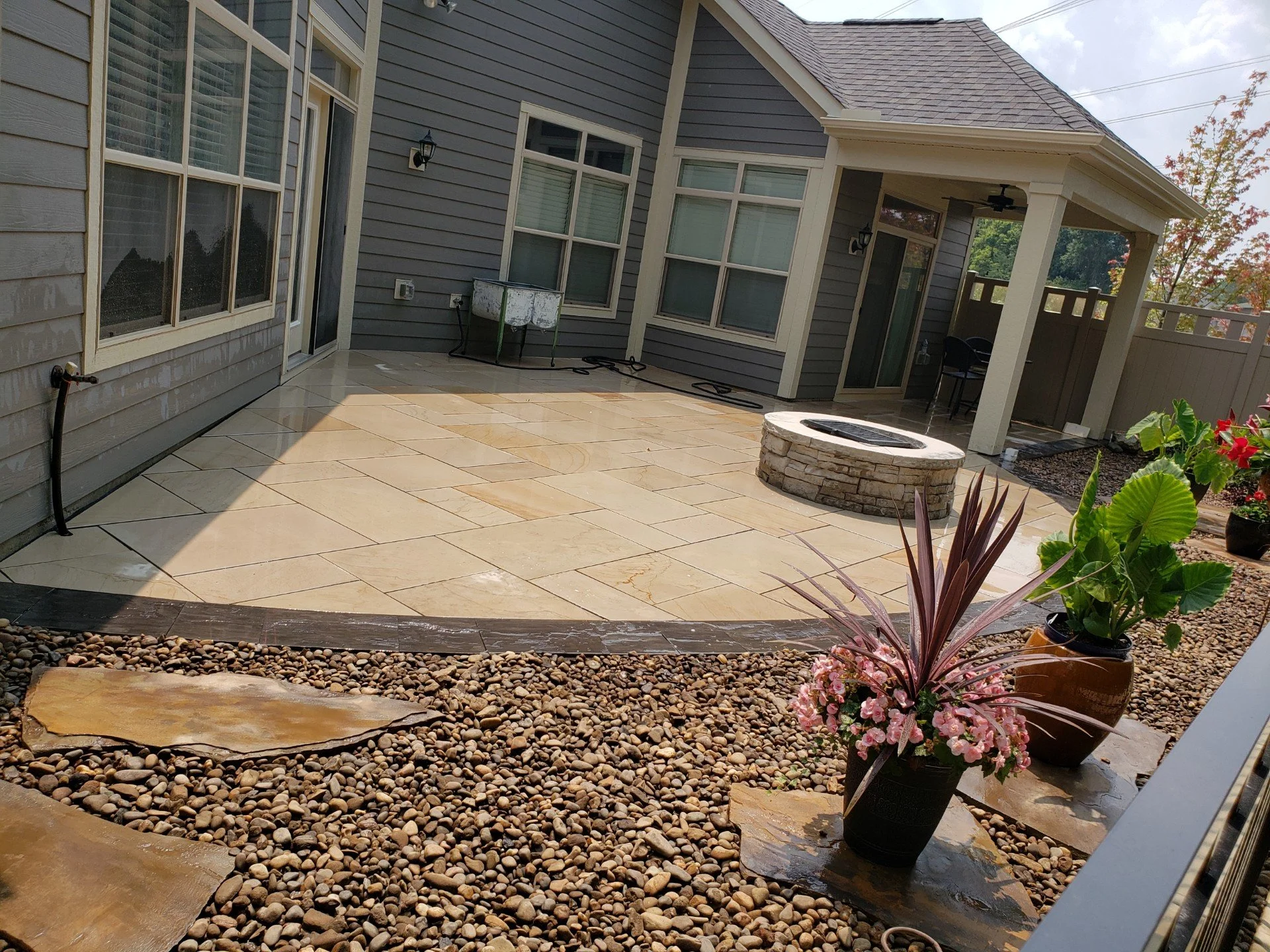 Stamped concrete patio with stone fire pit