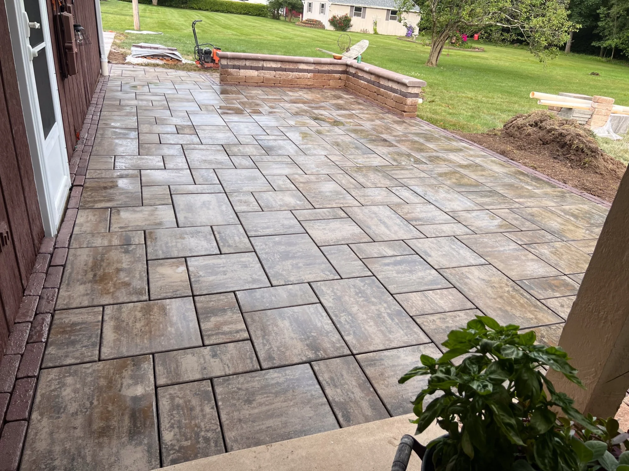 Stamped concrete patio with paver border