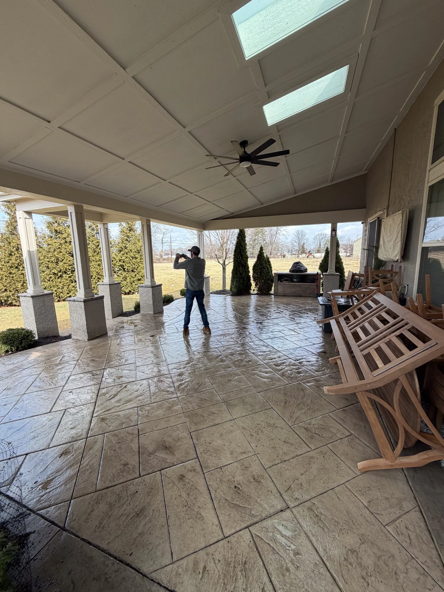 Massive covered stamped concrete porch
