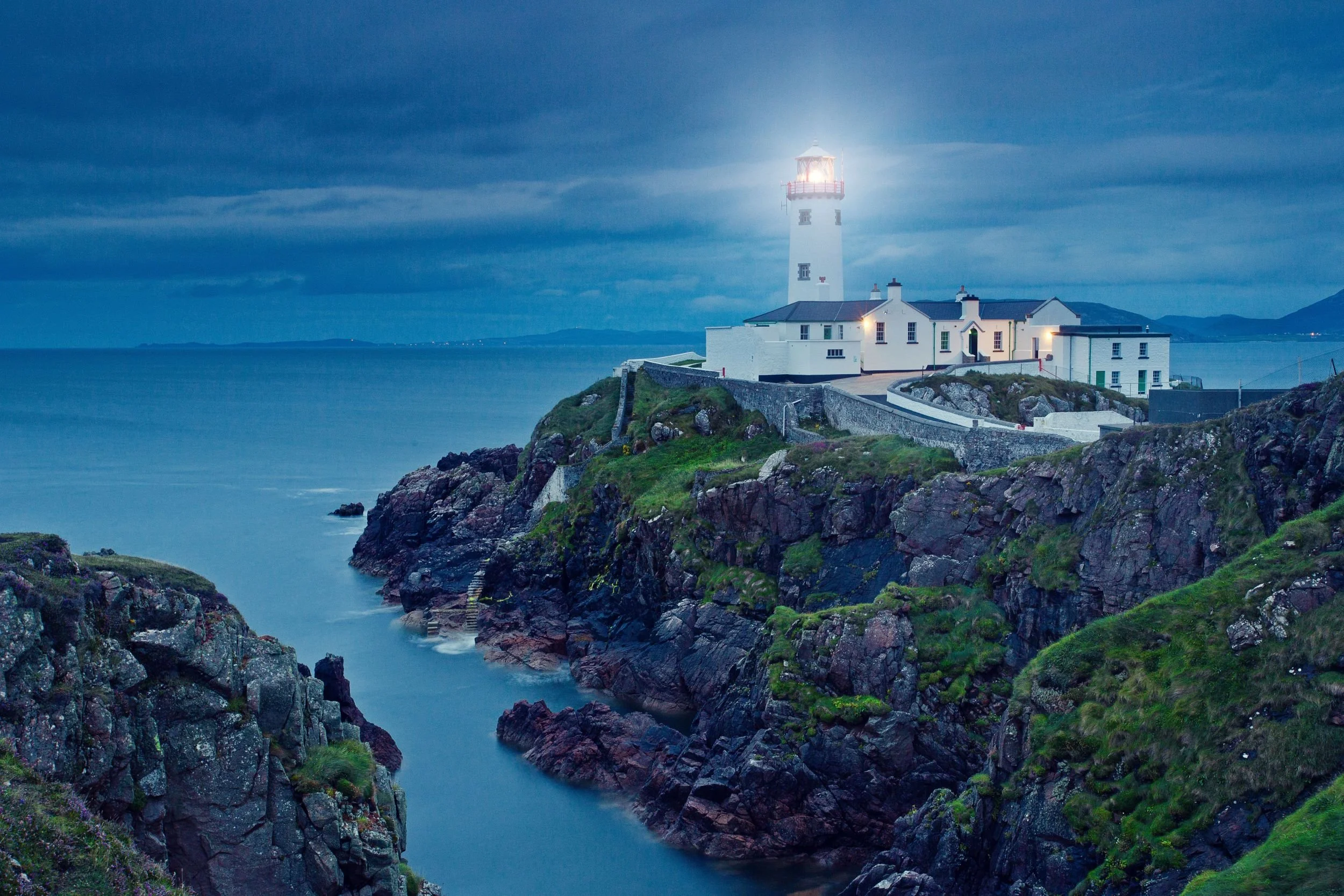 Lighthouse on a rocky Irish headland — ESG due diligence and investor readiness