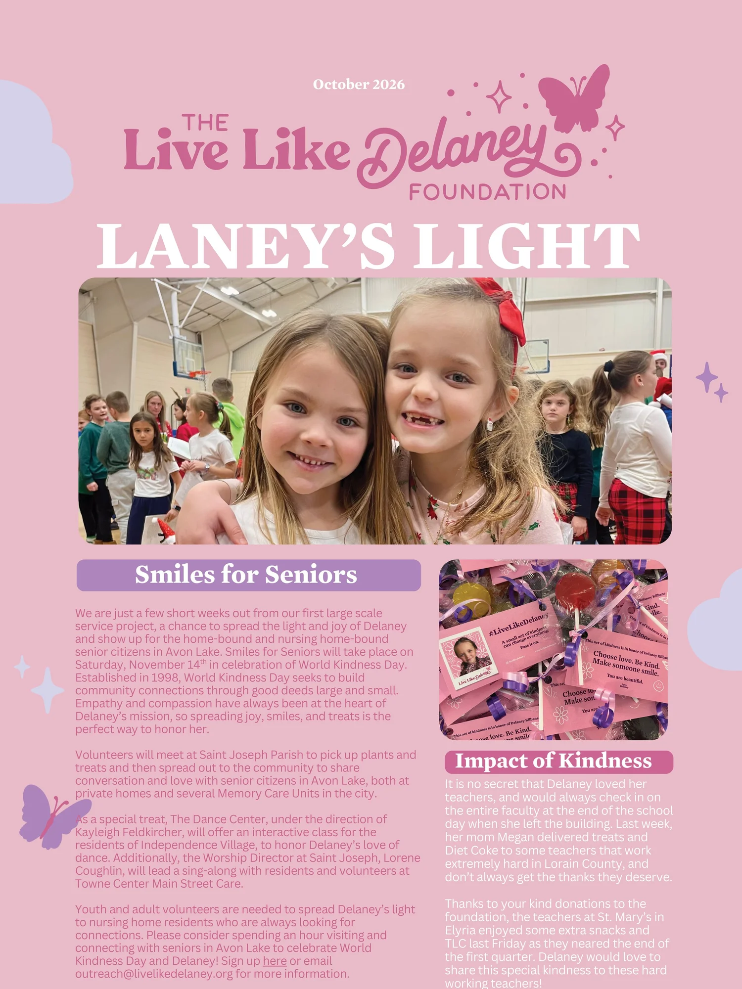 Two smiling girls with their arms around each other, with a gym full of children behind them