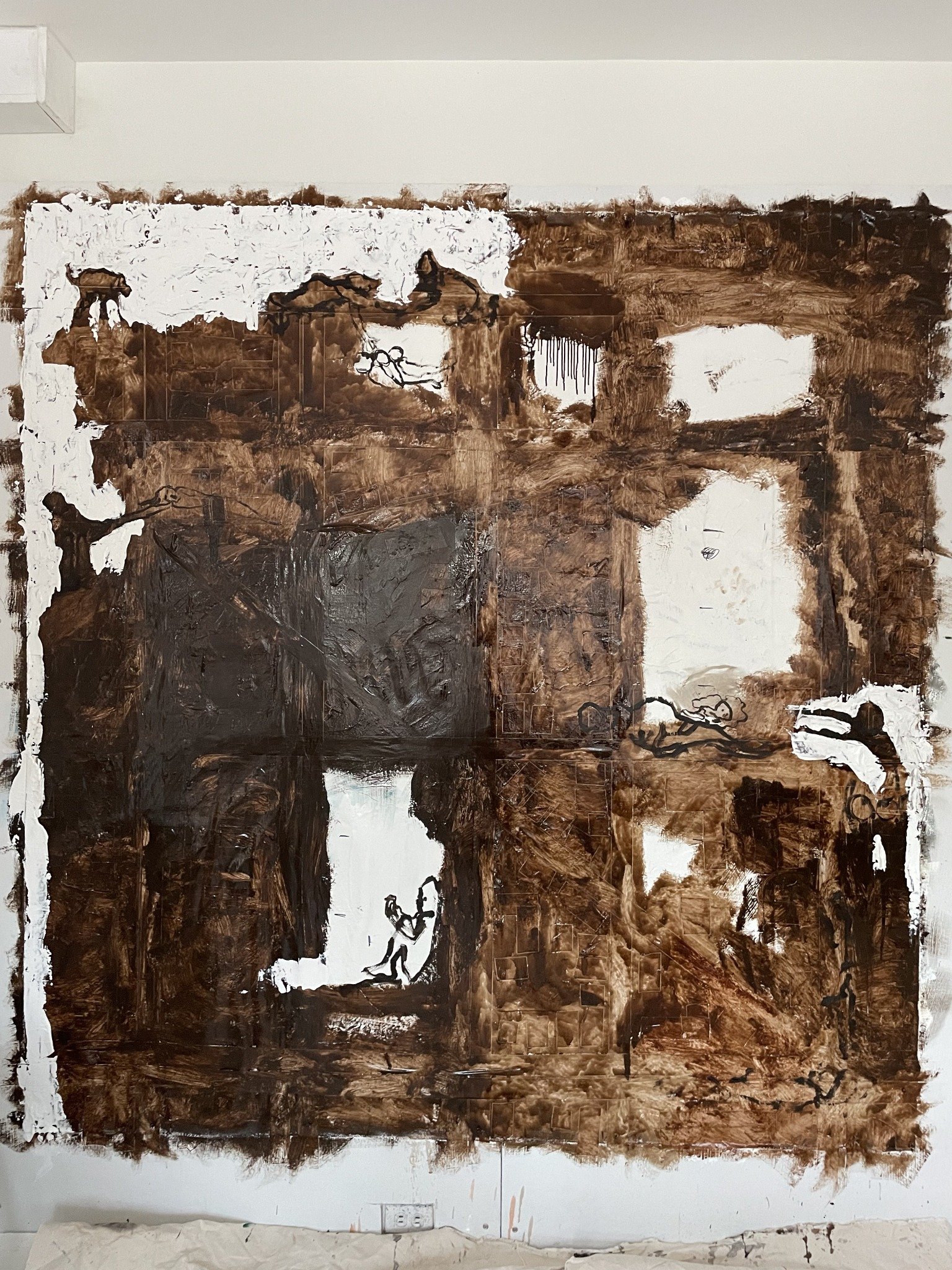 Erin McGee Ferrell’s large earthquake oil painting on canvas, with brown and white areas, architectural markings, and small outlined figures, photographed on the studio wall.