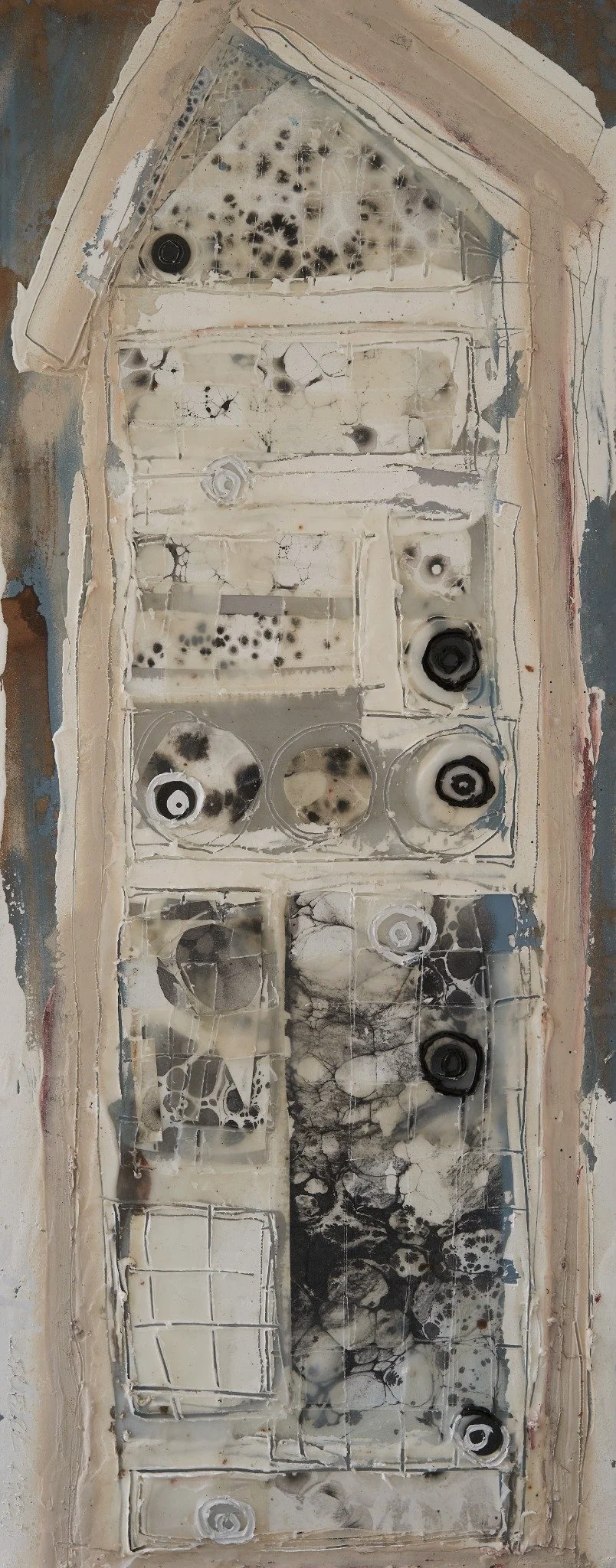 Insect Hotels by Erin McGee Ferrell. A tall pale house form with marbled paper in stacked compartments.
