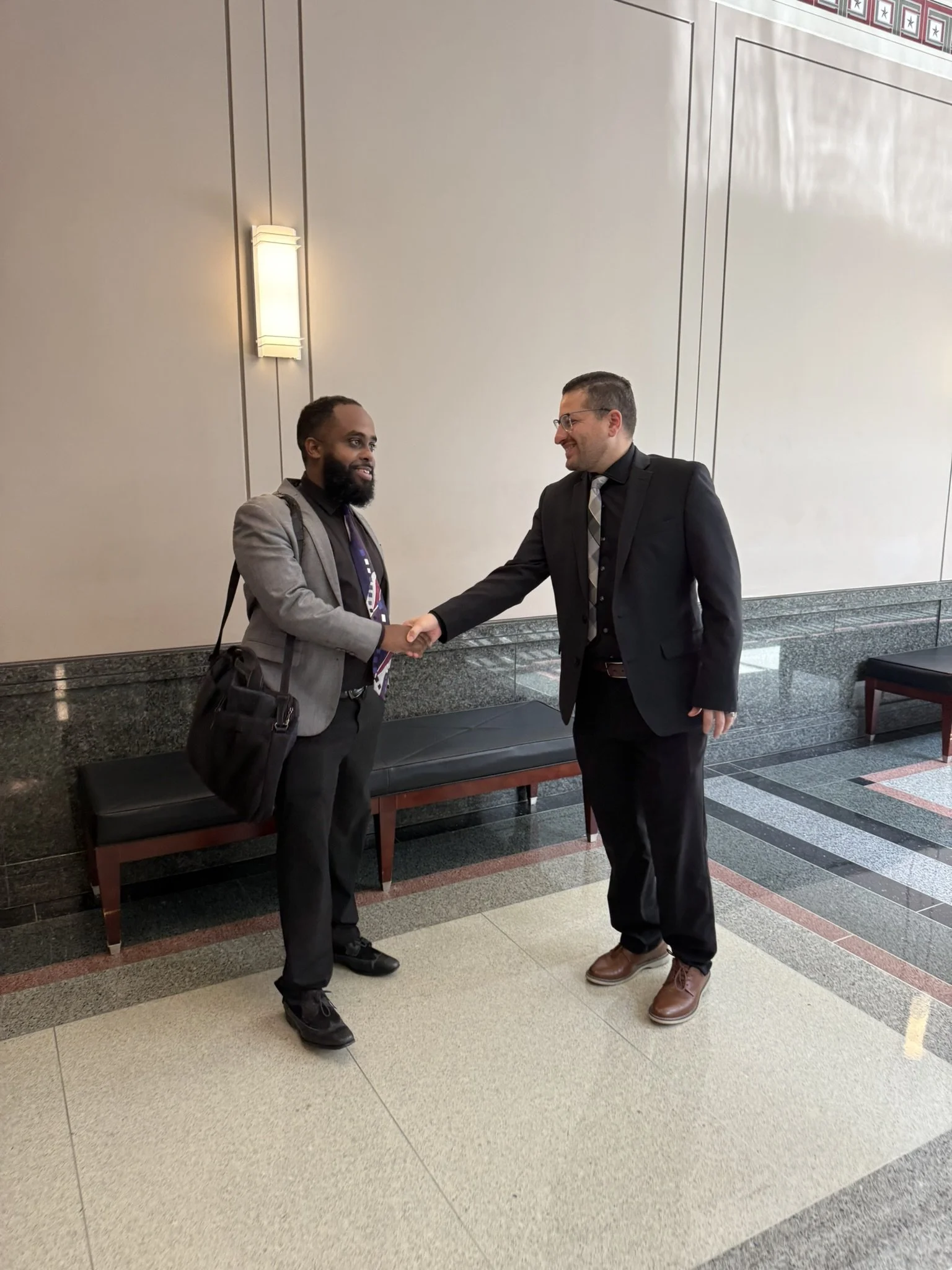 Yoel Zehaie with client after court