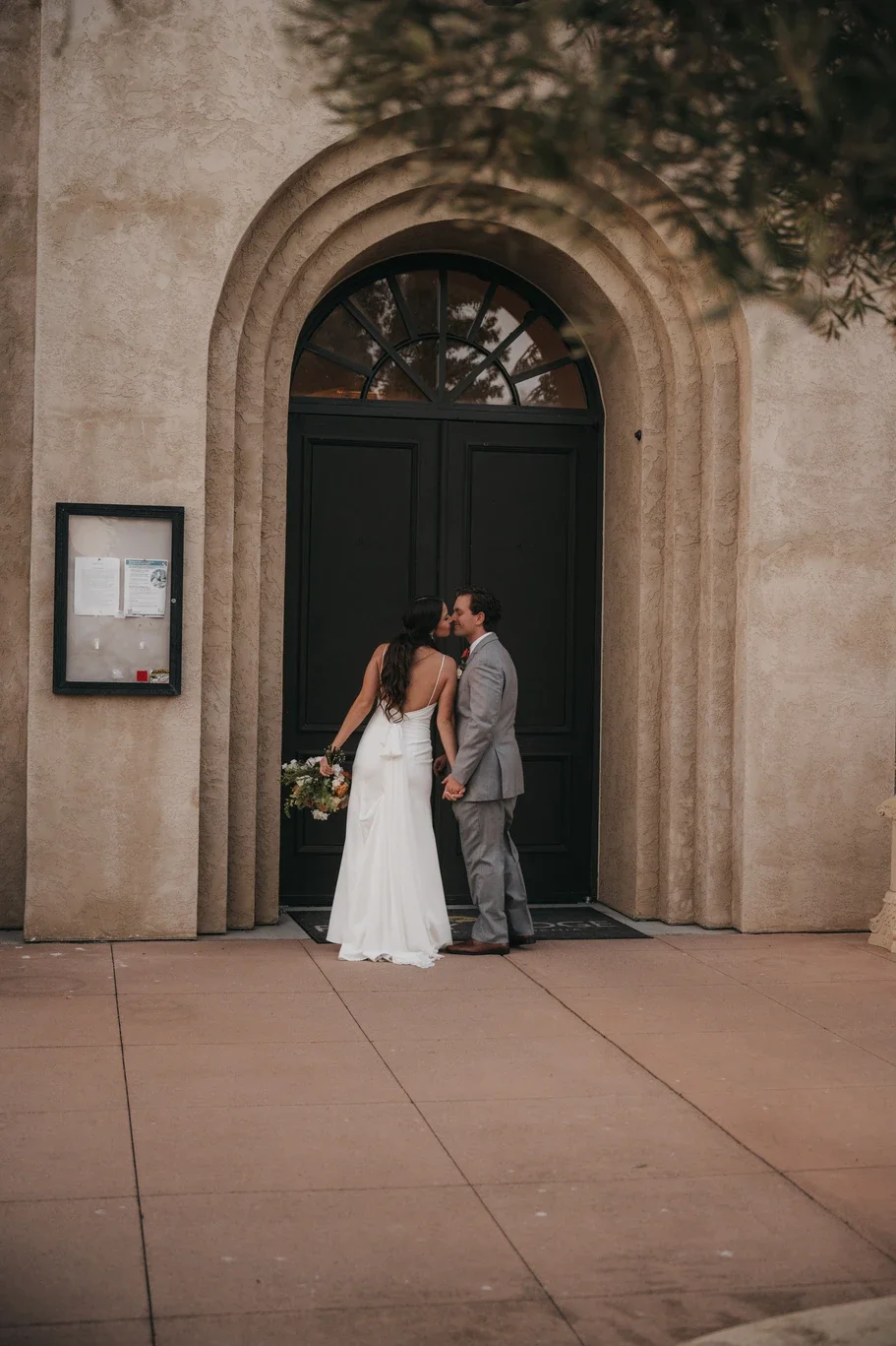 Catherine and Michael in the arched doorway of the chapel