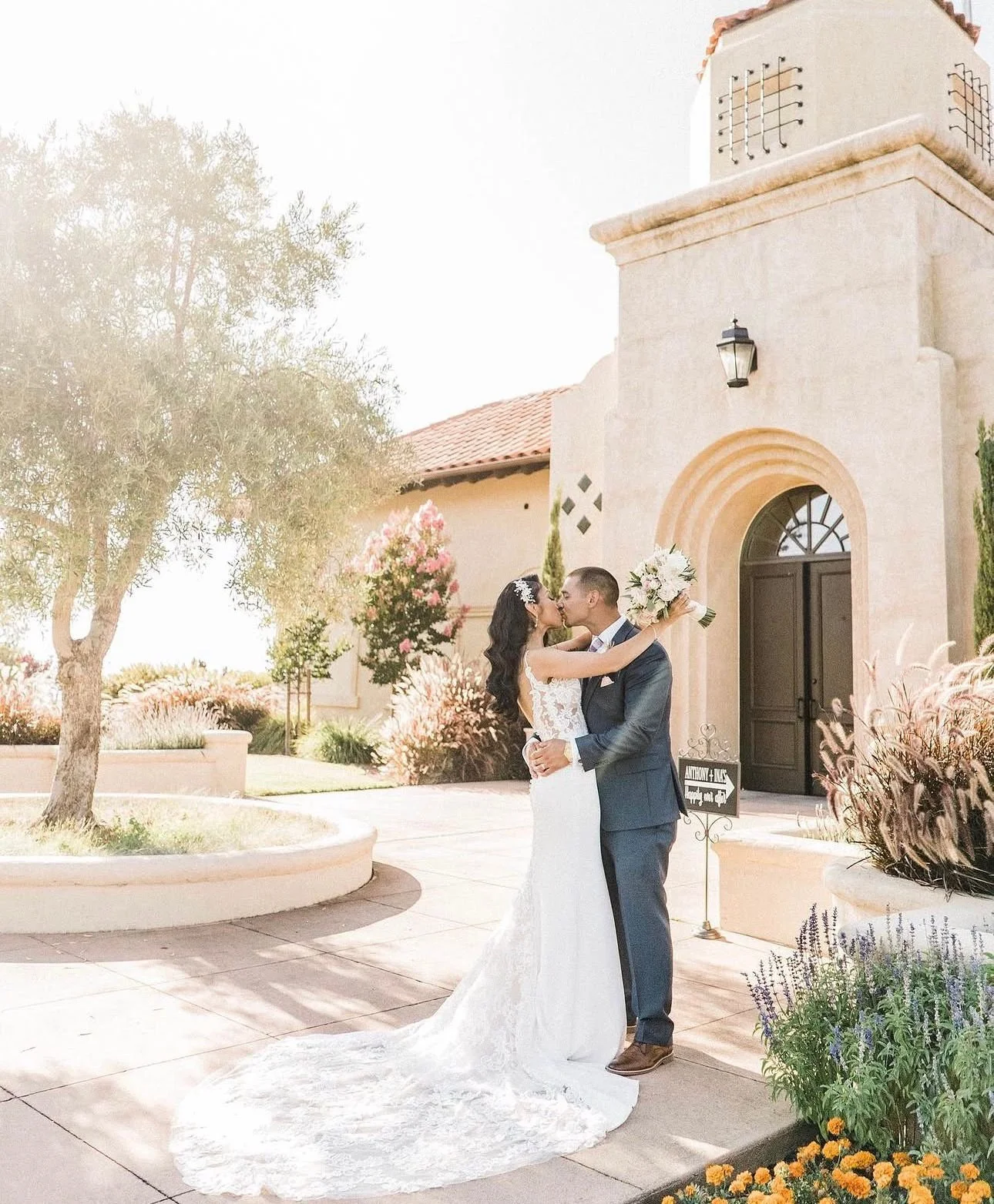 Ina and Mitchell outside a Spanish-style mission