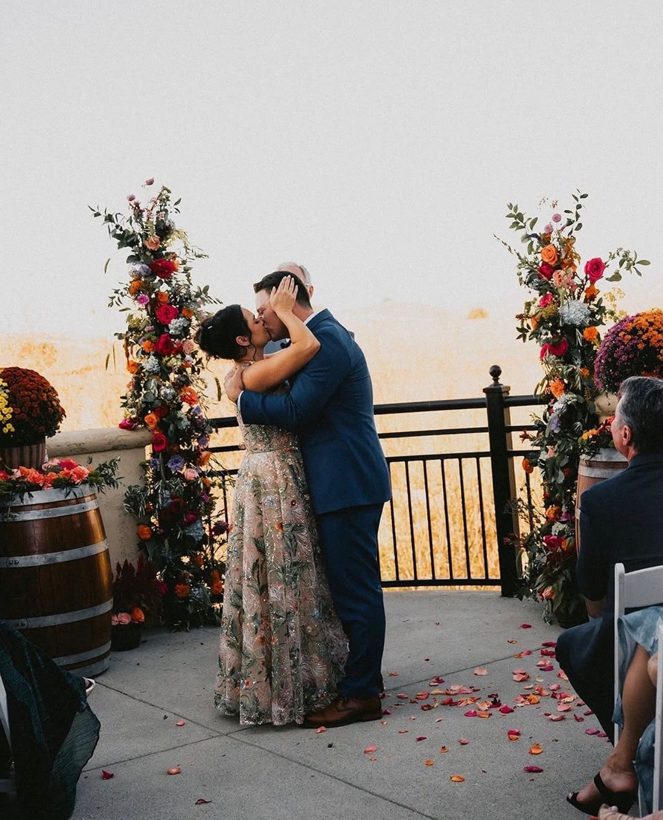Christina and Mason at a rooftop sunset ceremony