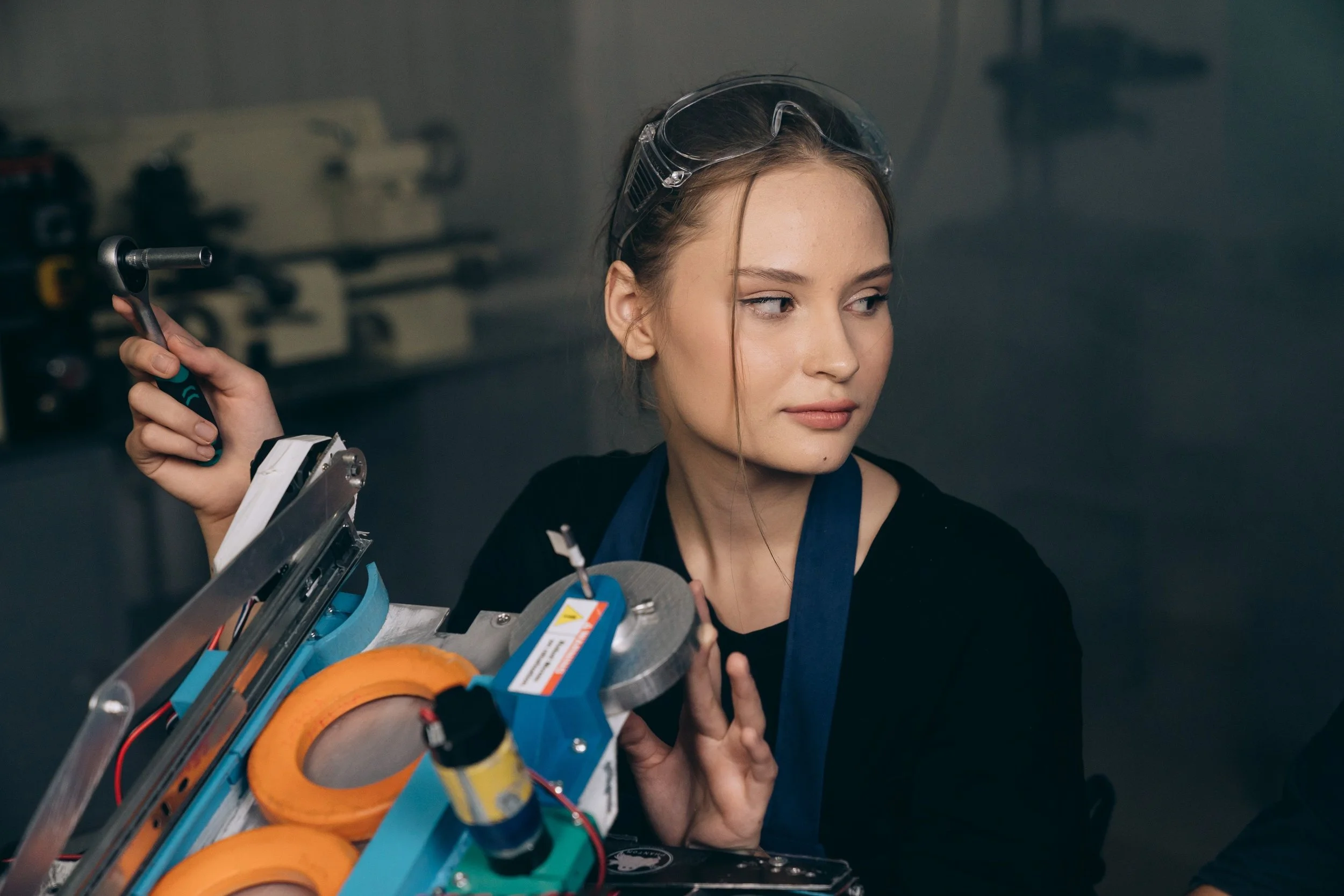 A learner working alongside aviation professionals in an operational environment.