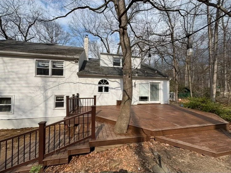 Custom built multi-level deck with wrapping staircase in Montgomery County PA by True North Builders