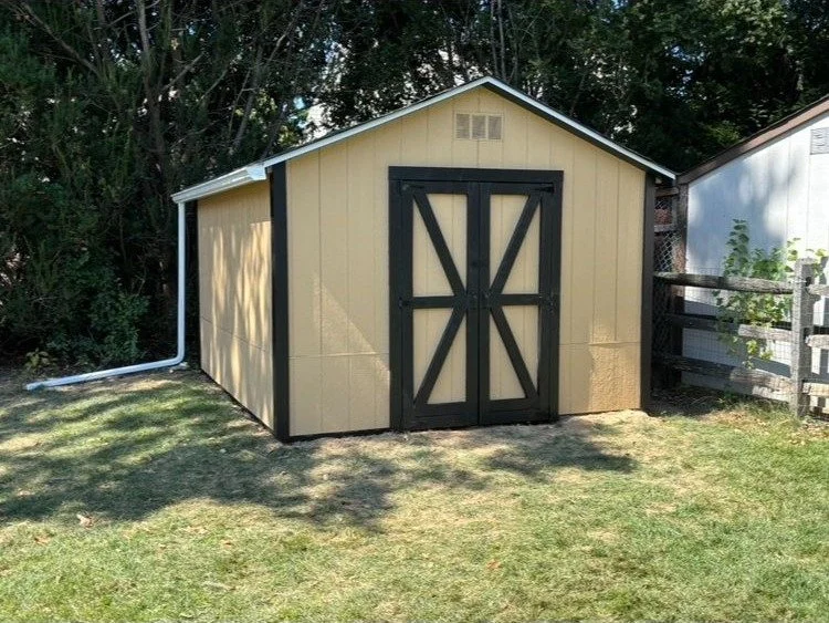 Custom-built storage shed with painted trim and double doors in Montgomery County PA