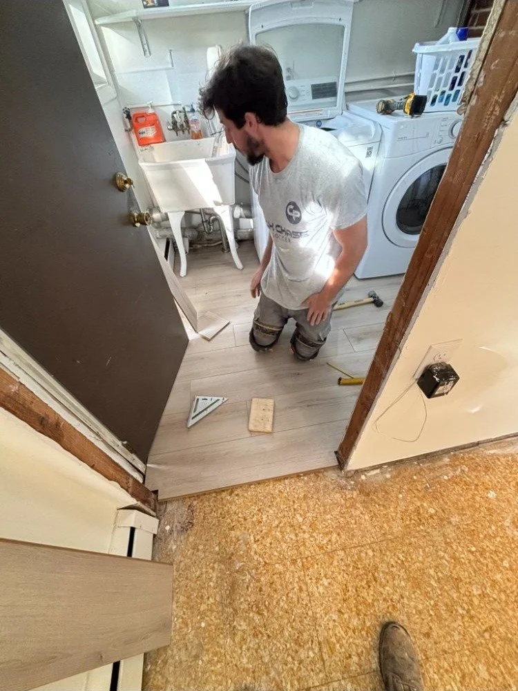 Craftsman installing hardwood flooring in Delaware County PA