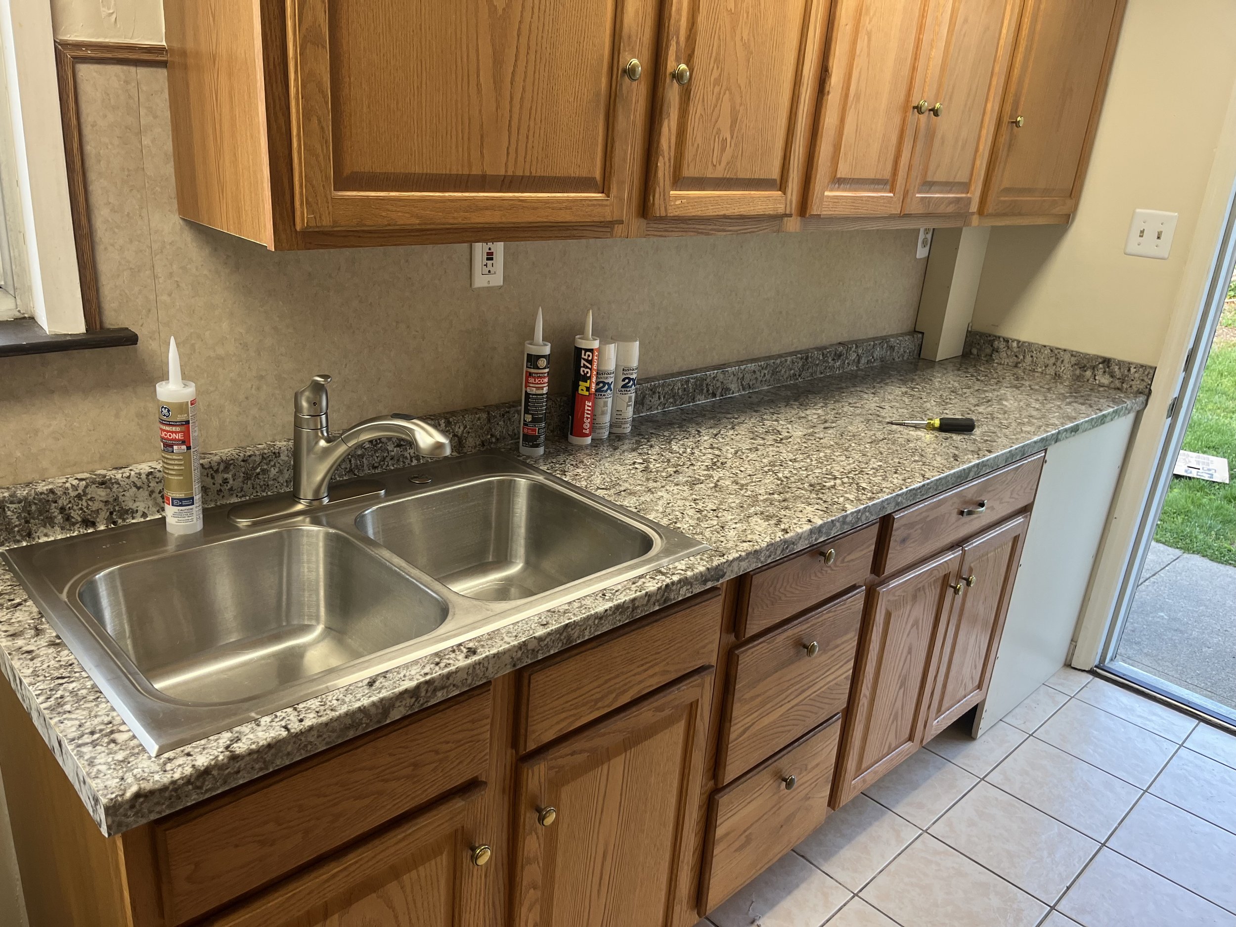 Custom oak kitchen cabinetry with granite countertops and new sink in Montgomery County PA