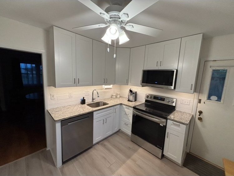 Completed kitchen remodel — gray shaker cabinets, granite countertops, stainless appliances, Montgomery County PA