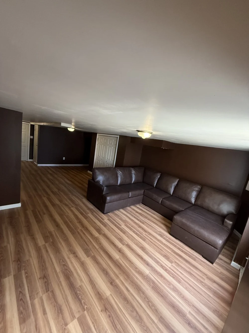 Finished basement playroom and lounge area
