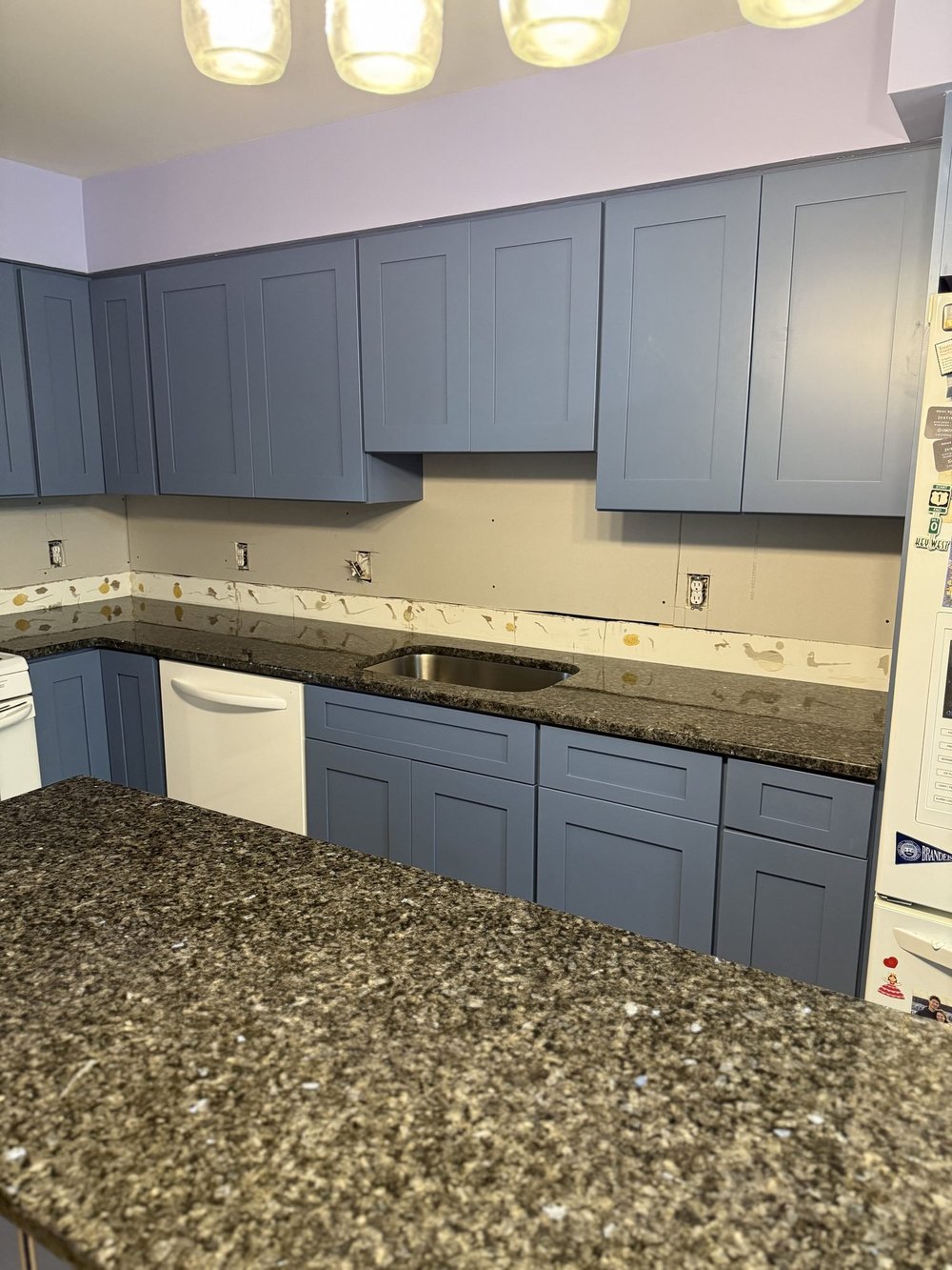 Tile backsplash being installed in an Elkins Park kitchen
