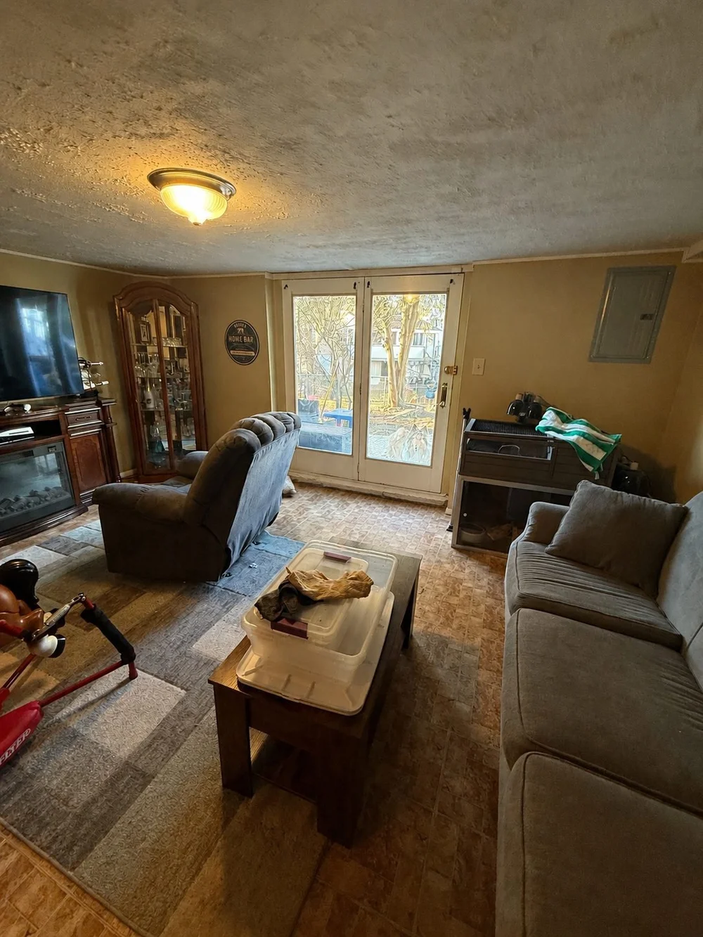 Basement before finishing — unfinished lounge and bar area in a Northeast Philadelphia home