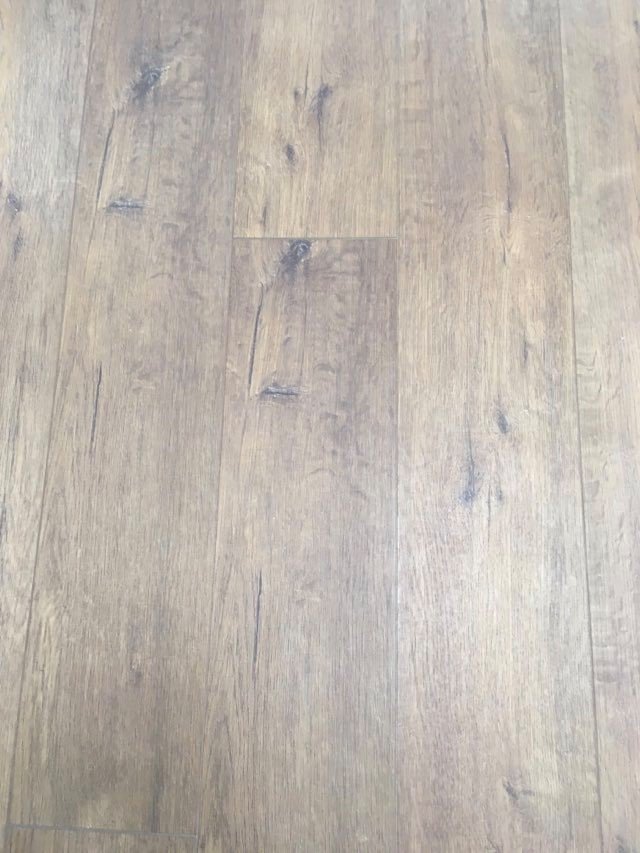 Wood-look vinyl plank flooring with visible grain and staggered joints