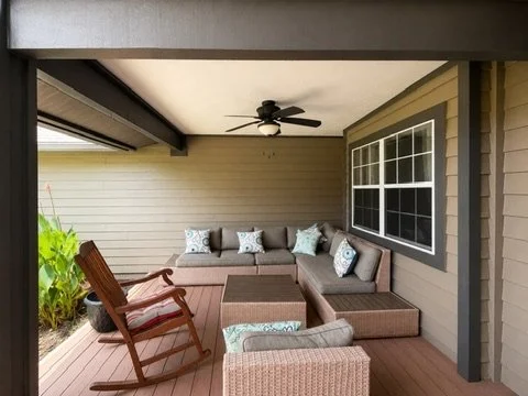 Covered porch with seating and painted ceiling