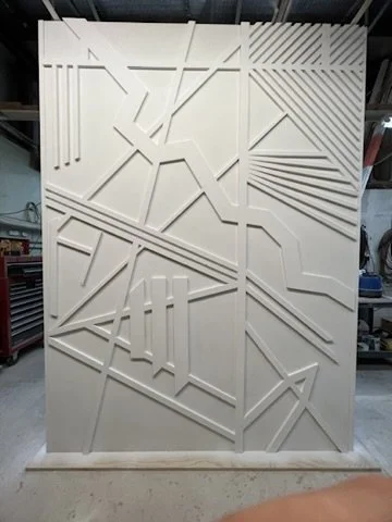 White finish applied to the raised geometric pattern