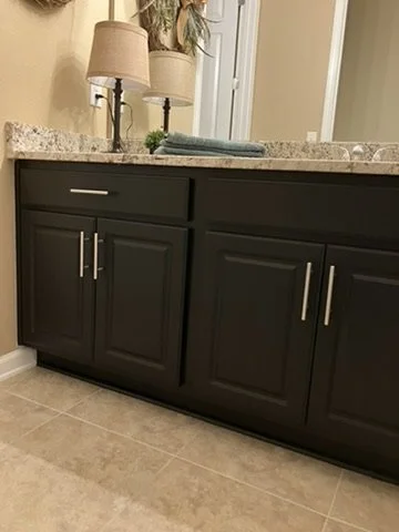 After refinishing — matching Tricorn Black finish on the second vanity