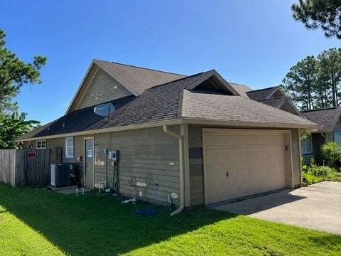 Before painting — side elevation beside the garage