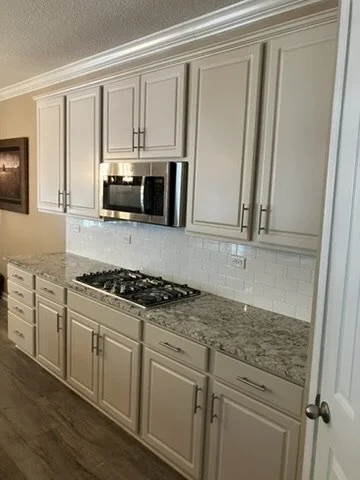 Custom-color range-wall cabinetry and drawers