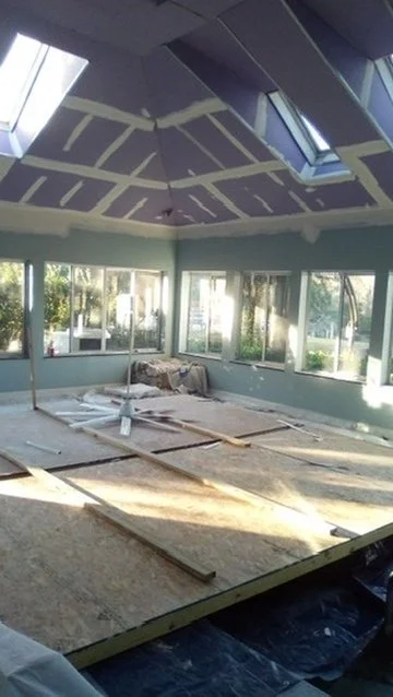 During renovation — protected pool and temporary work platform beneath the ceiling