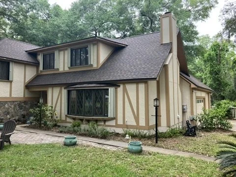 Traditional house exterior with contrasting timber-style trim
