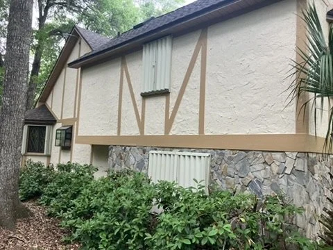 Finished side elevation with stonework and decorative trim