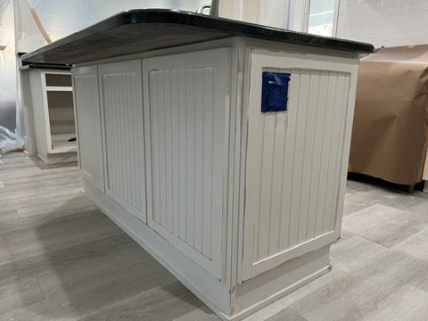 Paneled kitchen island during refinishing