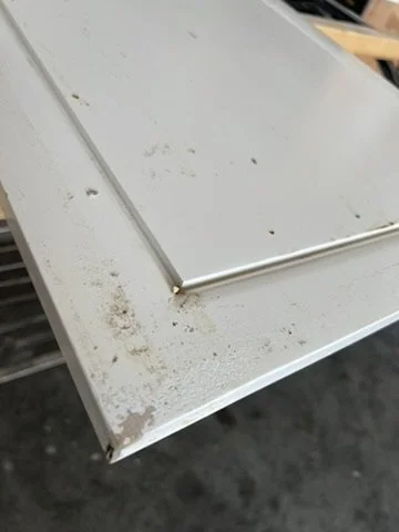Close view of a cabinet door surface before refinishing
