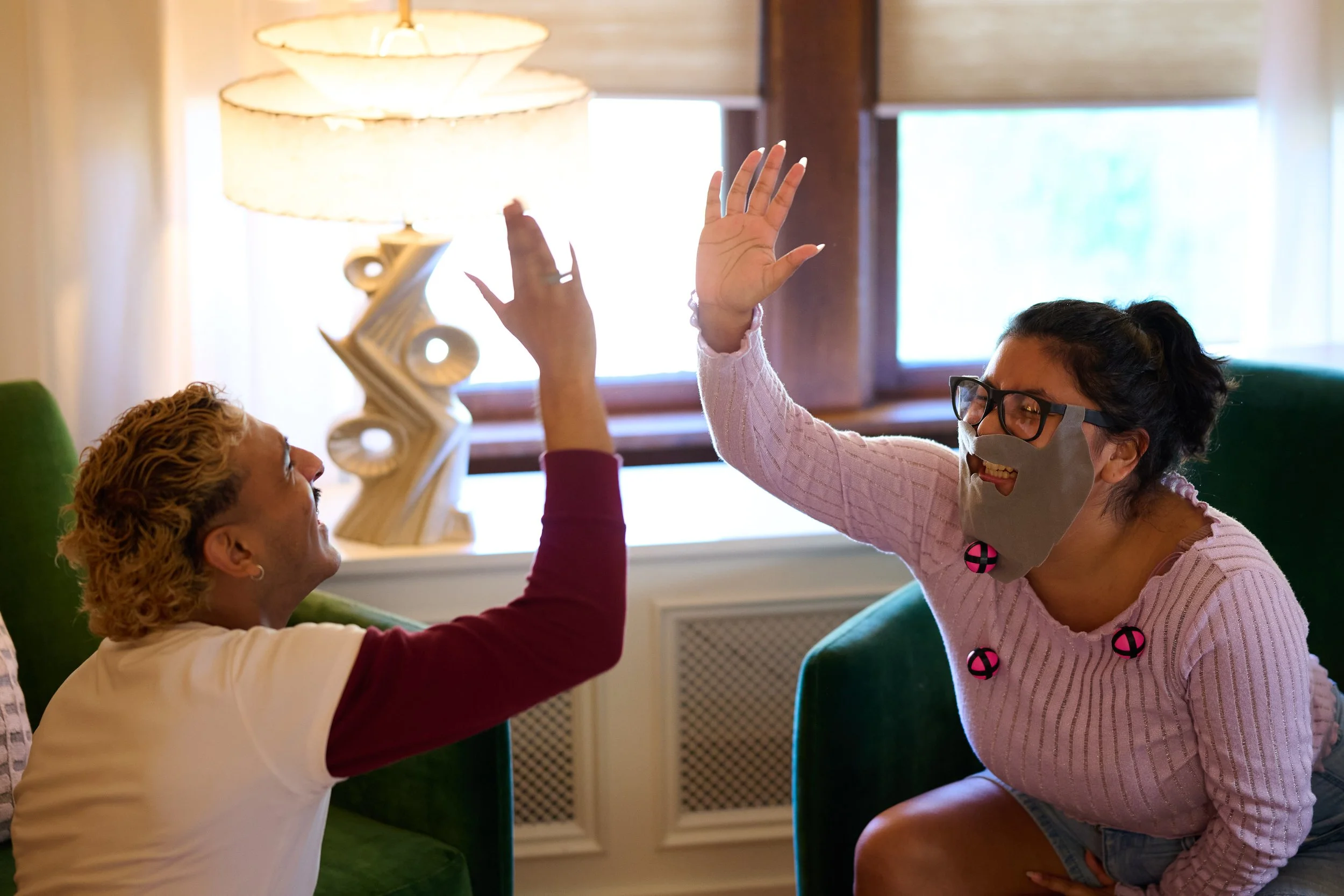 Friends enjoying a Hall Party game together
