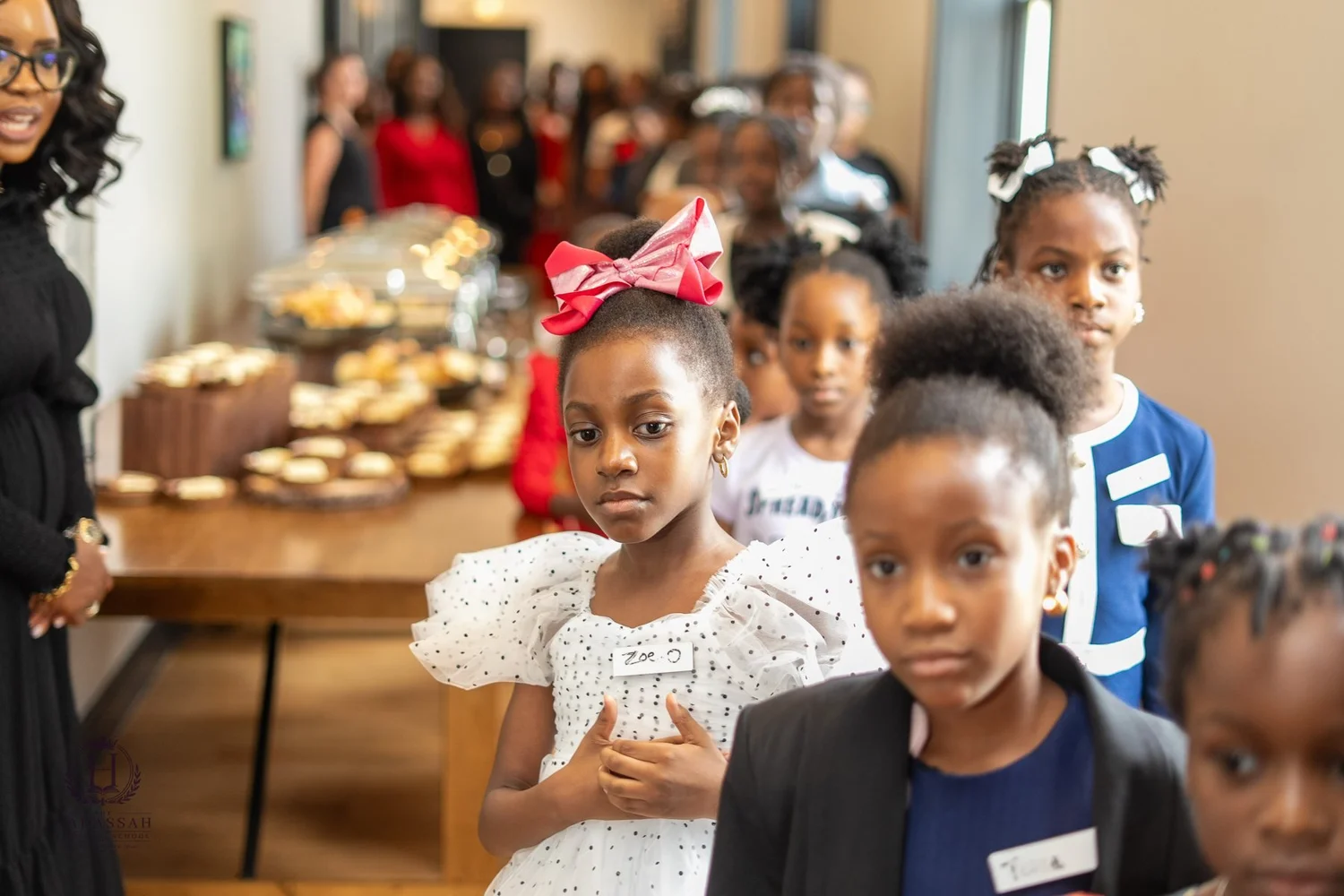Participants standing together beside the refreshment table
